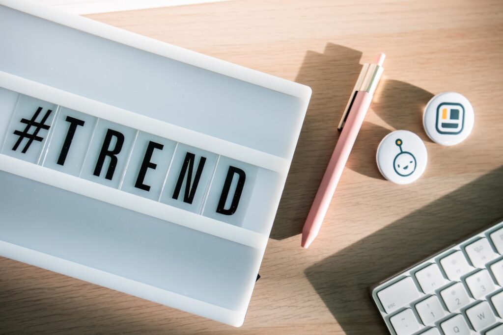 technology trends 2026 — Desk with a light box with the hashtag #trend and some stationary elements
