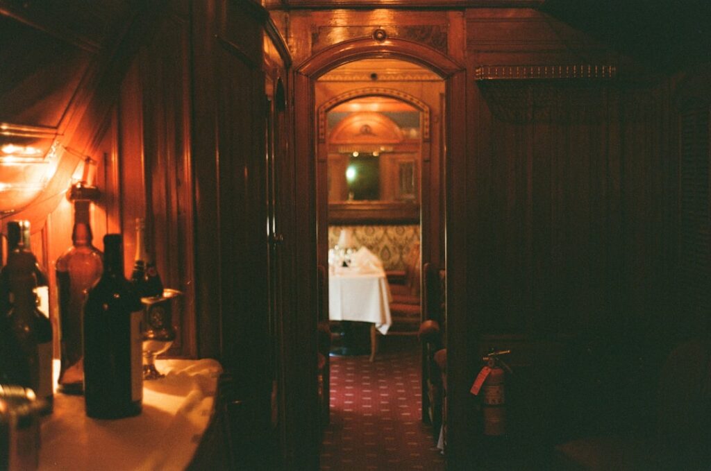 luxury train journeys redefine — vintage luxury train interior champagne