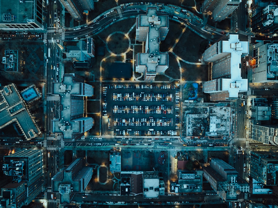future smart cities — future smart cities — aerial view of urban infrastructure with connected sensor network overlaid