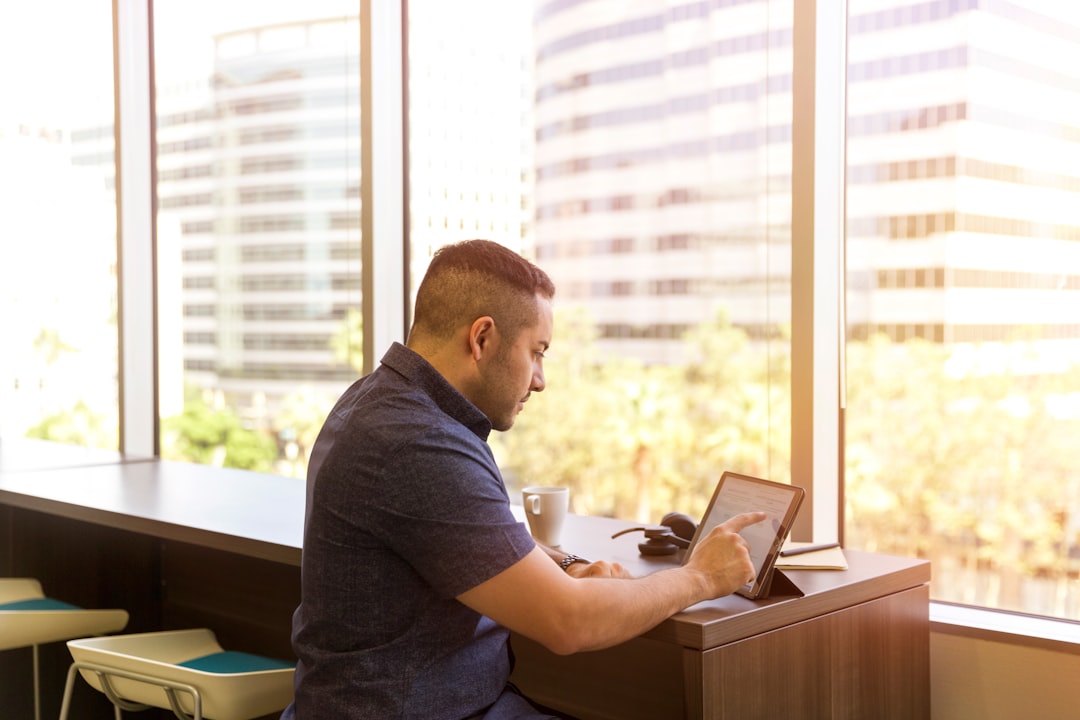 space technology new business — space technology new business — entrepreneur reviewing satellite Earth observation data on a tablet in a modern office setting