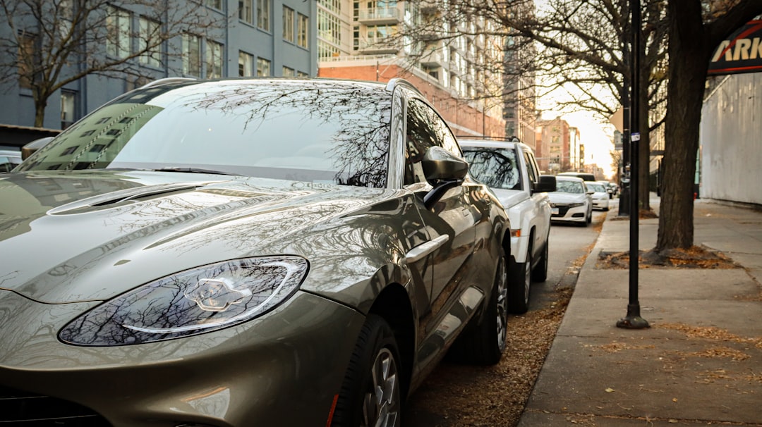 electric suvs reshaping urban mobility — compact electric SUV parked at a downtown street-level fast charger