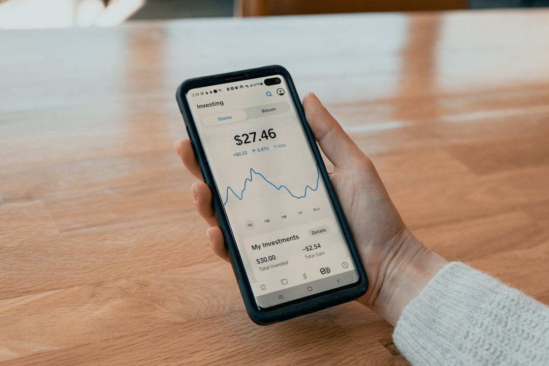 future personal wealth management — smartphone displaying investment dashboard with personalized portfolio metrics
