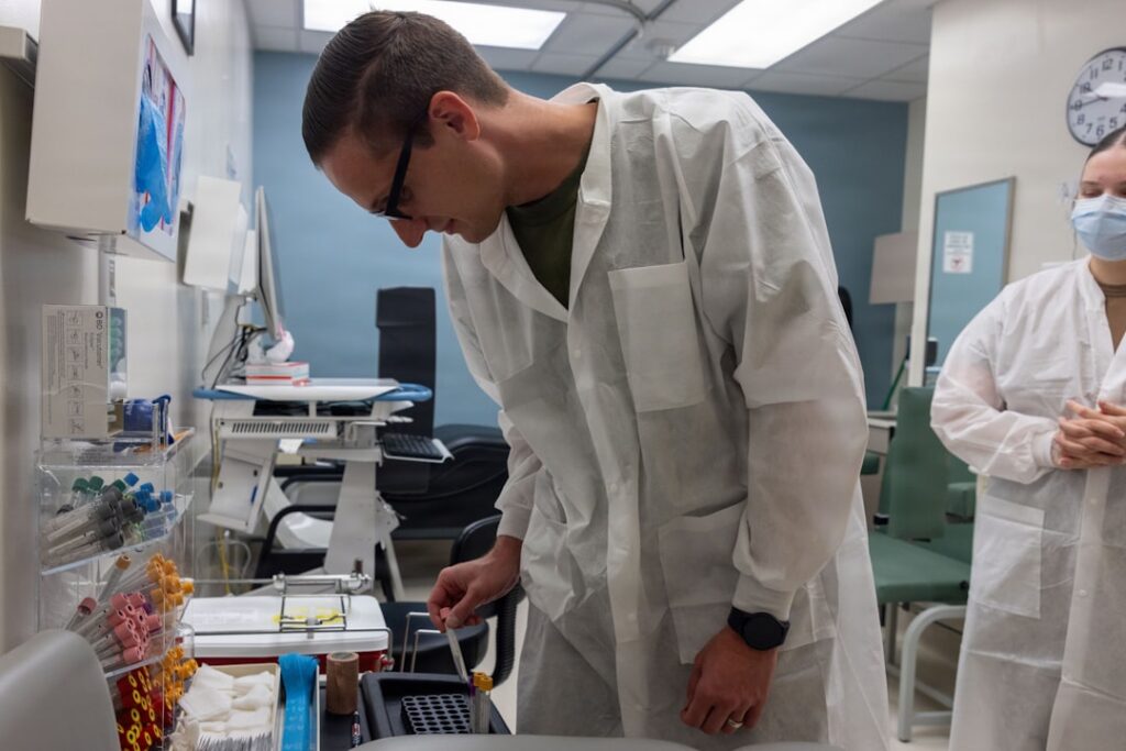 U.S. Navy Petty Officer 2nd Class Caleb Fraizer, hospital corpsman, Headquarters Company, Marine Corps Base Camp Blaz, prepares a blood collection tray at Naval Hospital Guam, Guam, Jan. 8, 2026. Corpsmen from MCB Camp Blaz participated in on-the-job training at different military medical clinics across the island in preparation to increase capabilities on Camp Blaz. (U.S. Marine Corps photo by Lance Cpl. Afton Smiley)
