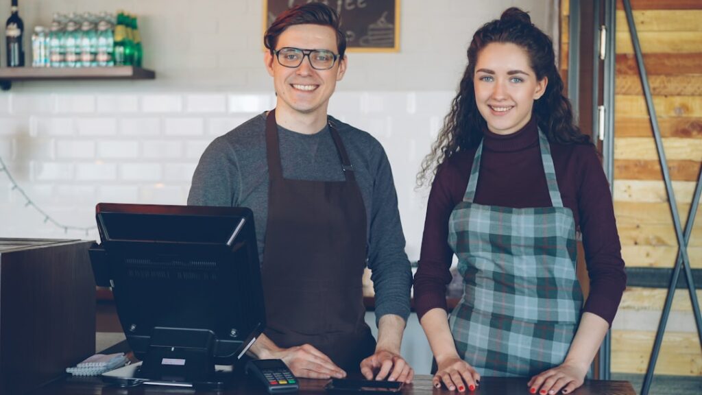 fintech financial access small — small business owner laptop payment app