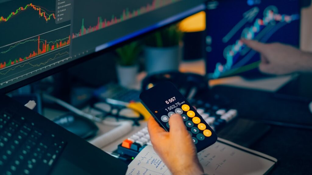 family offices global investment — wealth manager analyzing global markets screens