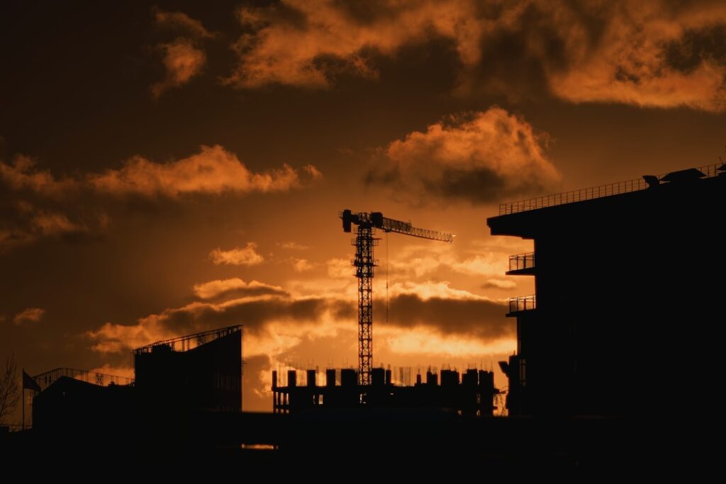 infrastructure investments drive economic — construction site crane urban skyline