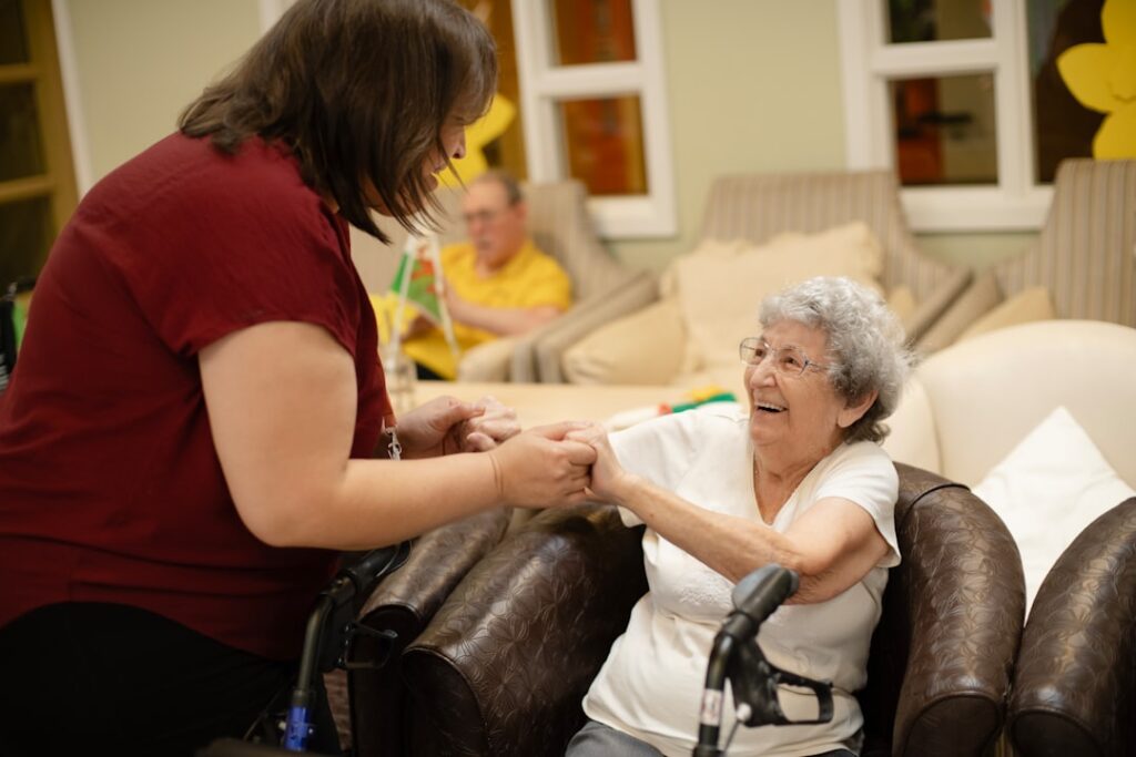 future robotics healthcare elder — robotic arm assisting elderly patient care