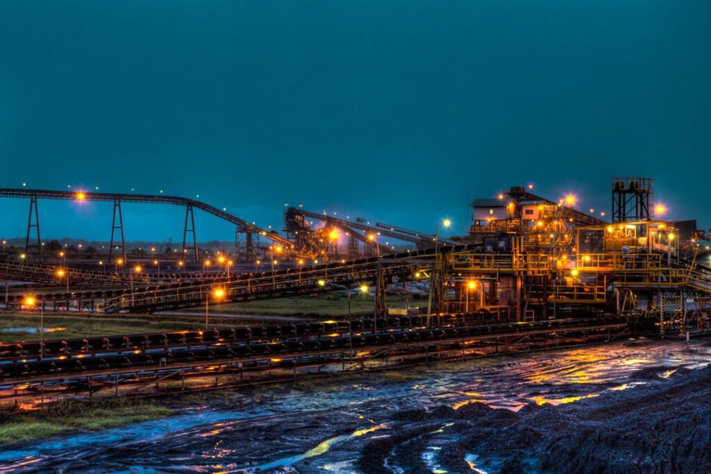 rare earth minerals critical — mining operation glowing mineral extraction