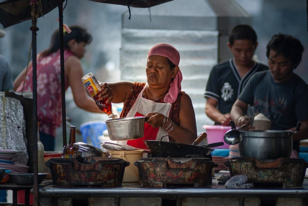 food tourism continues grow — street market vendor cooking dawn