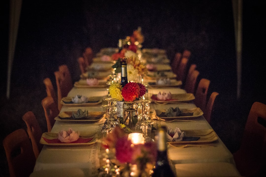 modern consumers luxury through experience — intimate private dinner setting with candlelit table and culinary presentation