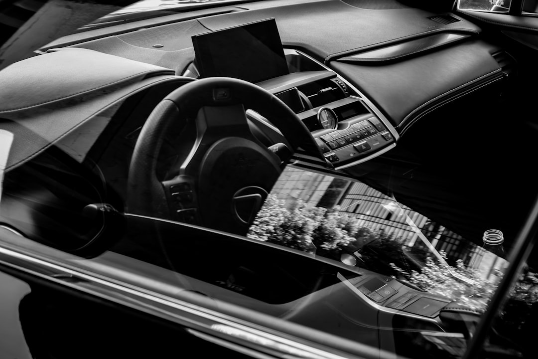 future in-car entertainment smart — modern car interior with curved OLED display and gesture control interface
