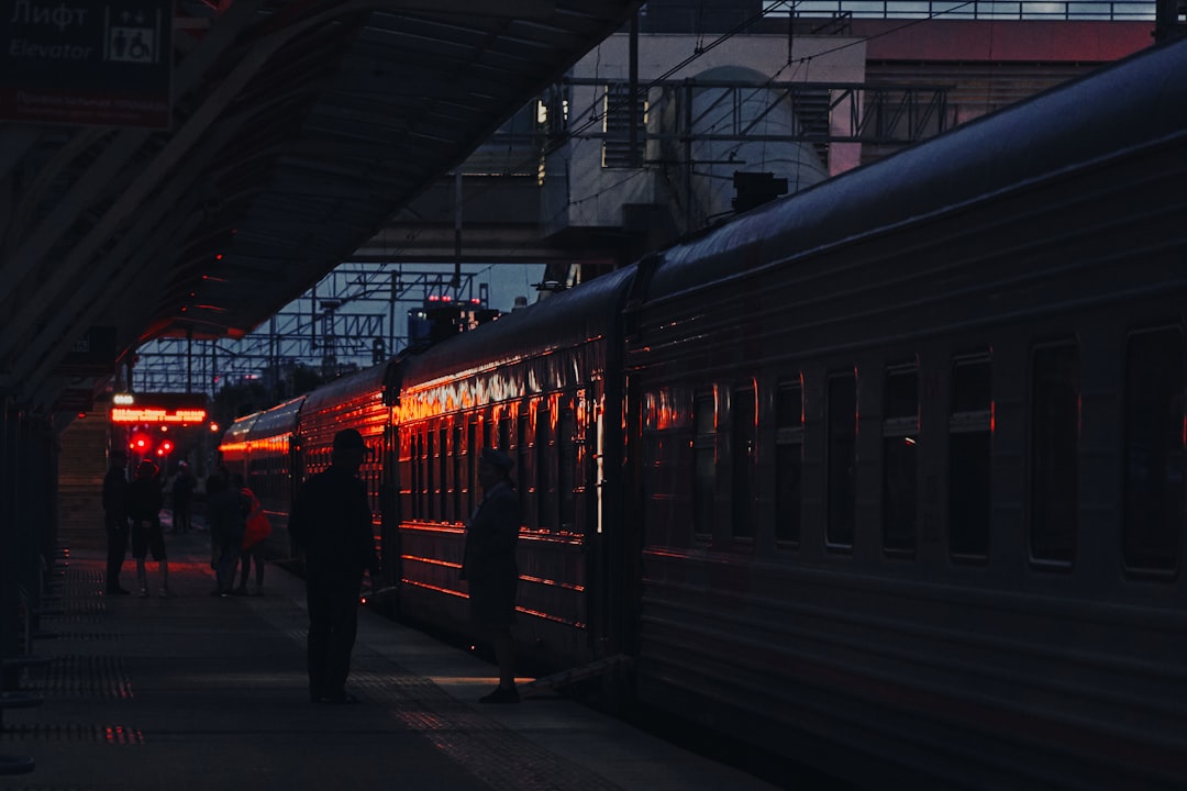 train travel comeback among — passengers boarding a luxury sleeper train at dusk