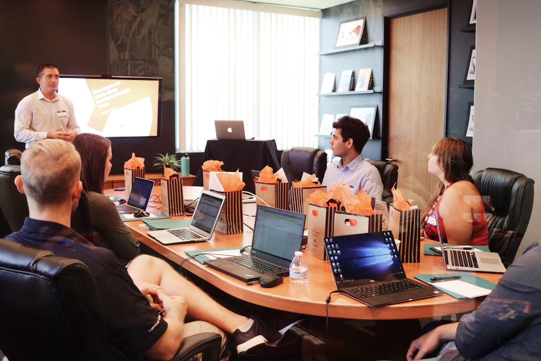 corporate venture capital rapidly — boardroom meeting with charts and investment analysis on screens