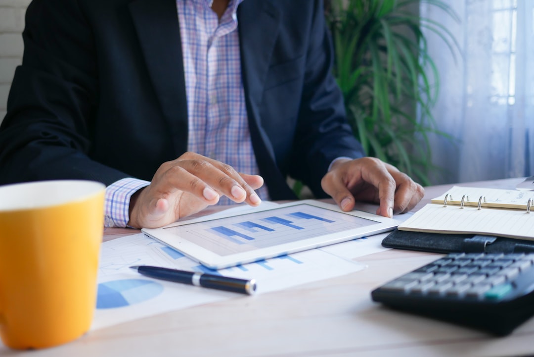corporate venture capital rapidly — investor reviewing startup portfolio metrics on tablet