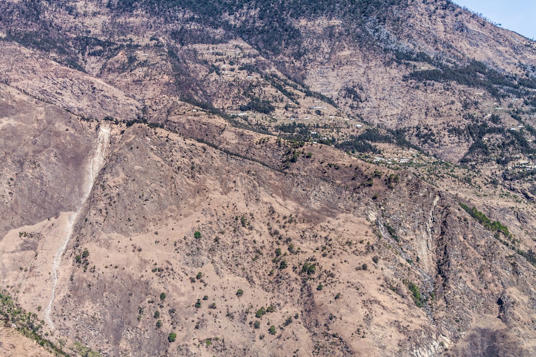 growing role satellite internet — satellite dish installation in mountainous rural terrain