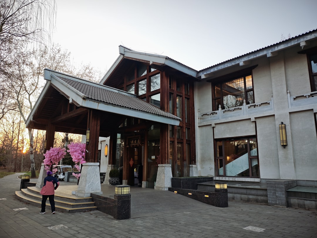 heritage hotels continue attract — a 1933 Japanese schoolhouse transformed into modern luxury hotel room with original wooden beams