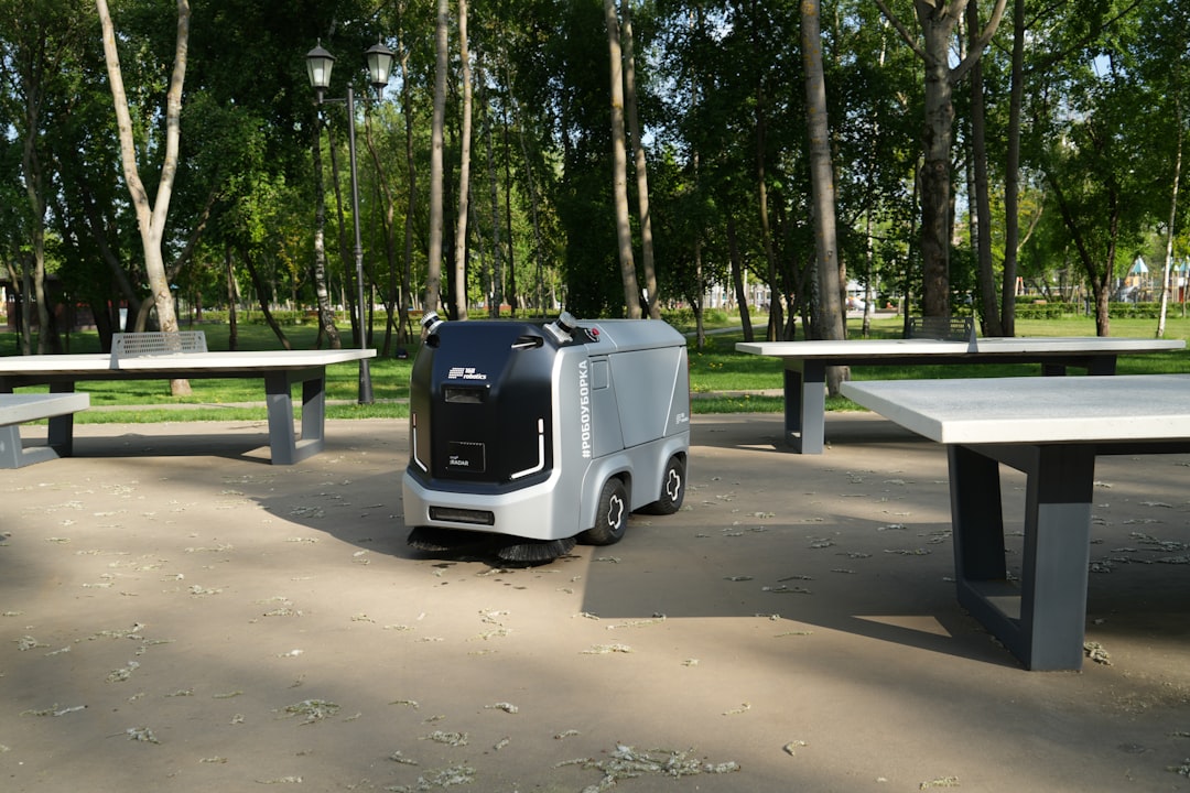 autonomous delivery systems momentum — package drop-off point at residential building entrance