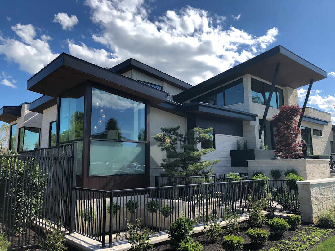 future luxury residential developments — modern luxury home exterior with smart home integration and waterfront views
