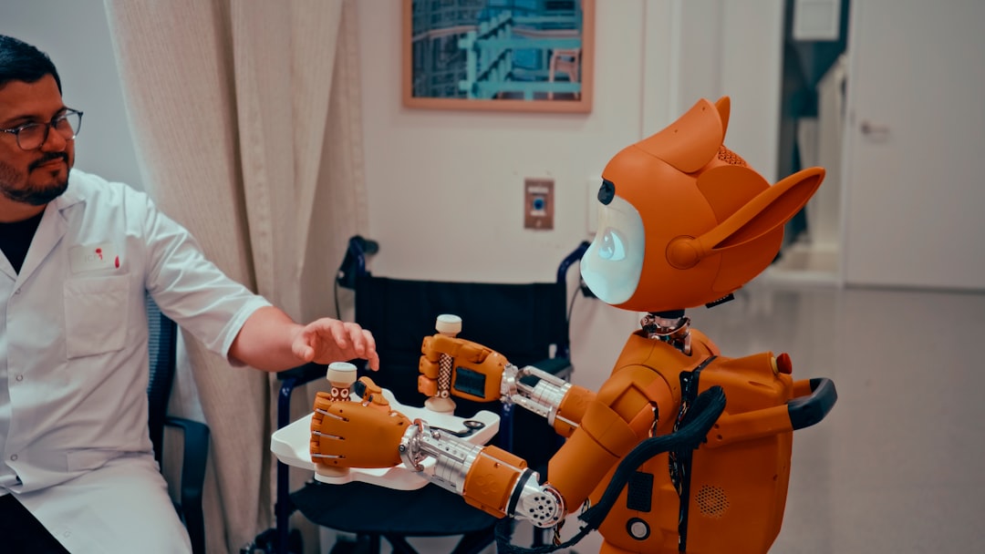 future robotics healthcare elder — nurse training elderly patient to use voice-activated robot assistant in care home