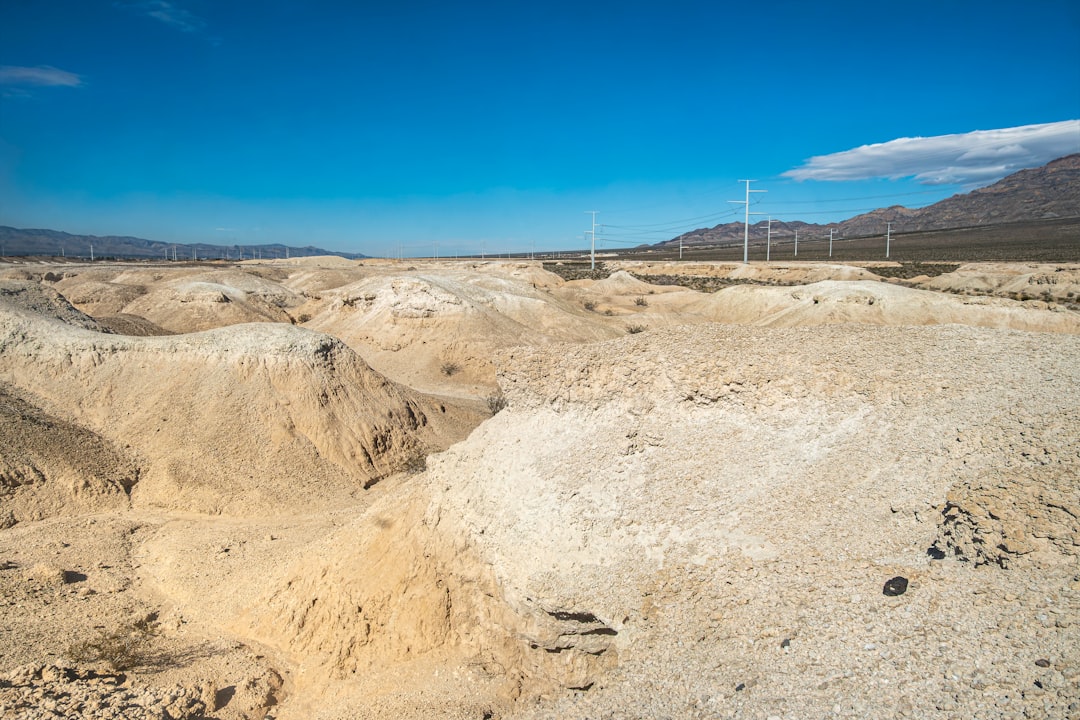 rare earth minerals critical — industrial mining operation in remote desert landscape