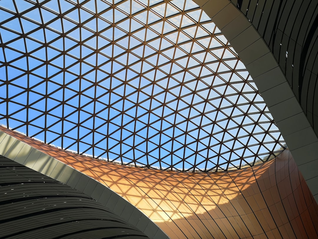 innovative airport designs around — sleek modern terminal with geometric ceiling and natural light