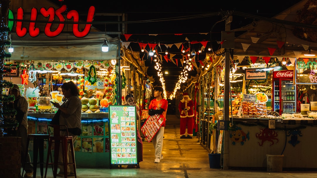 food tourism continues grow — street food vendor preparing noodles in Bangkok night market