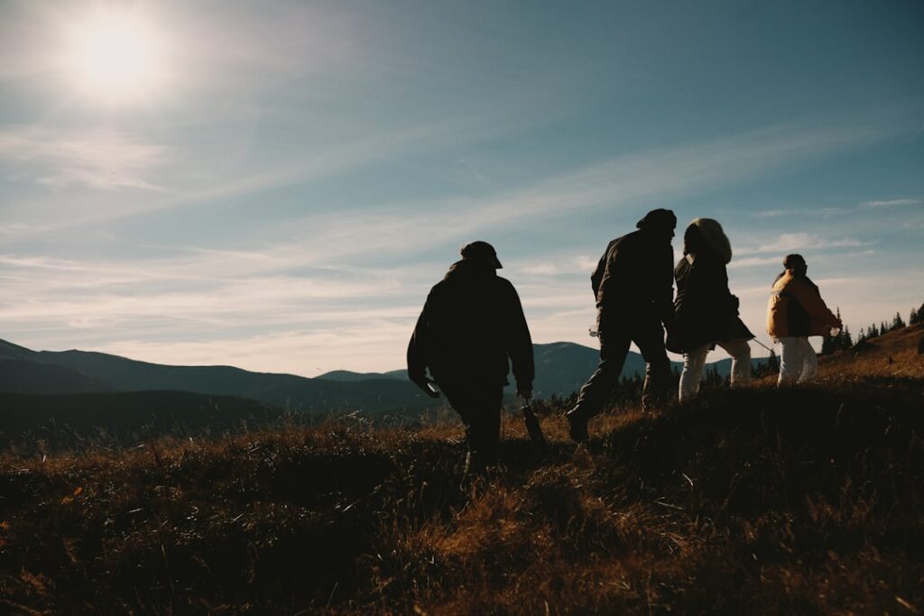future multi-generational travel experiences — multigenerational family hiking mountain landscape