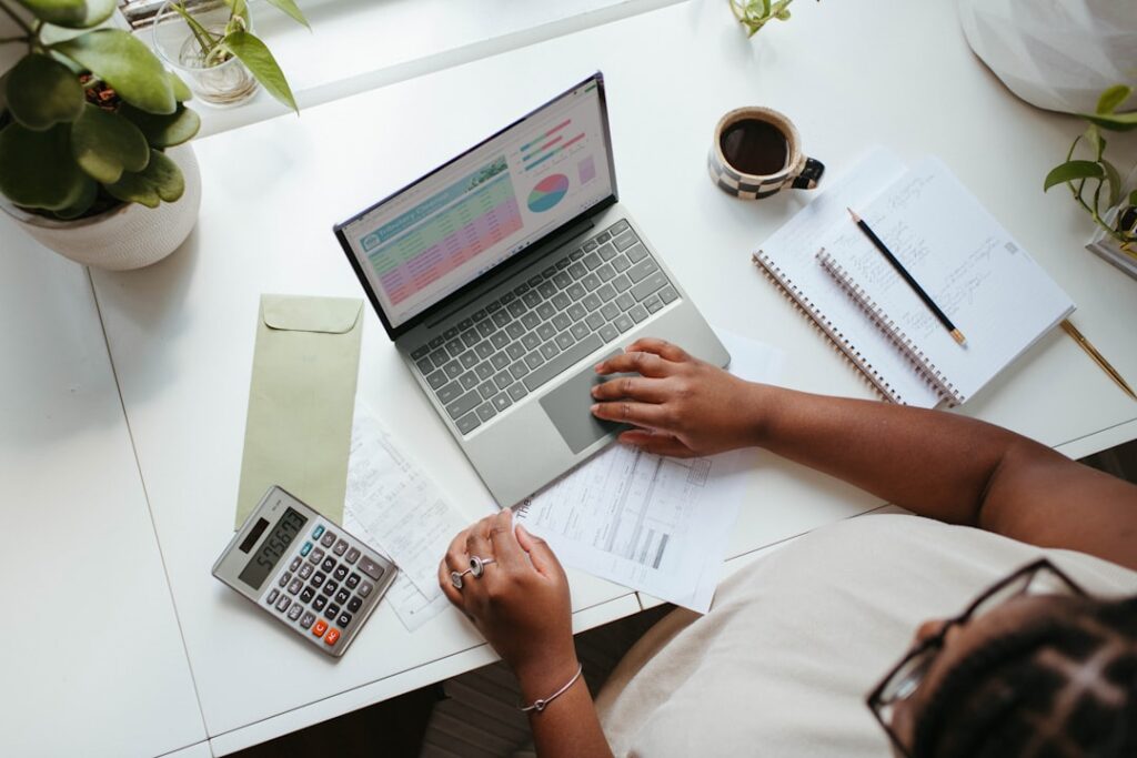growing importance financial literacy — person reviewing budget spreadsheet carefully
