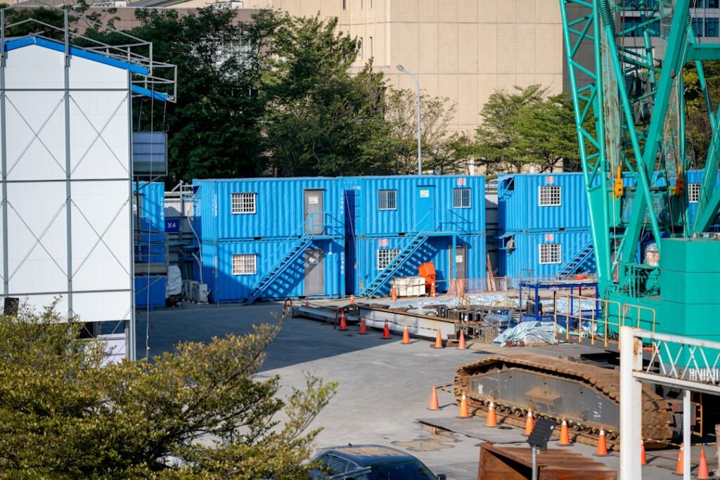 modular construction ground global — Prefabricated building modules stacked site