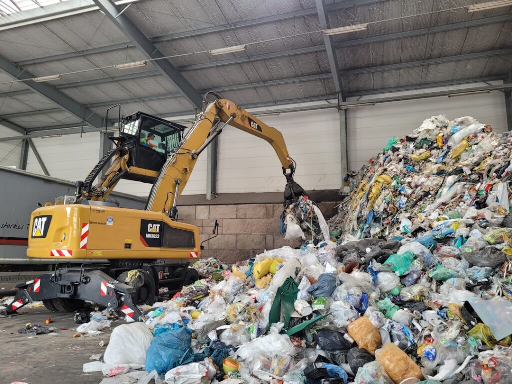 rise circular manufacturing push — Industrial factory recycling sorting facility