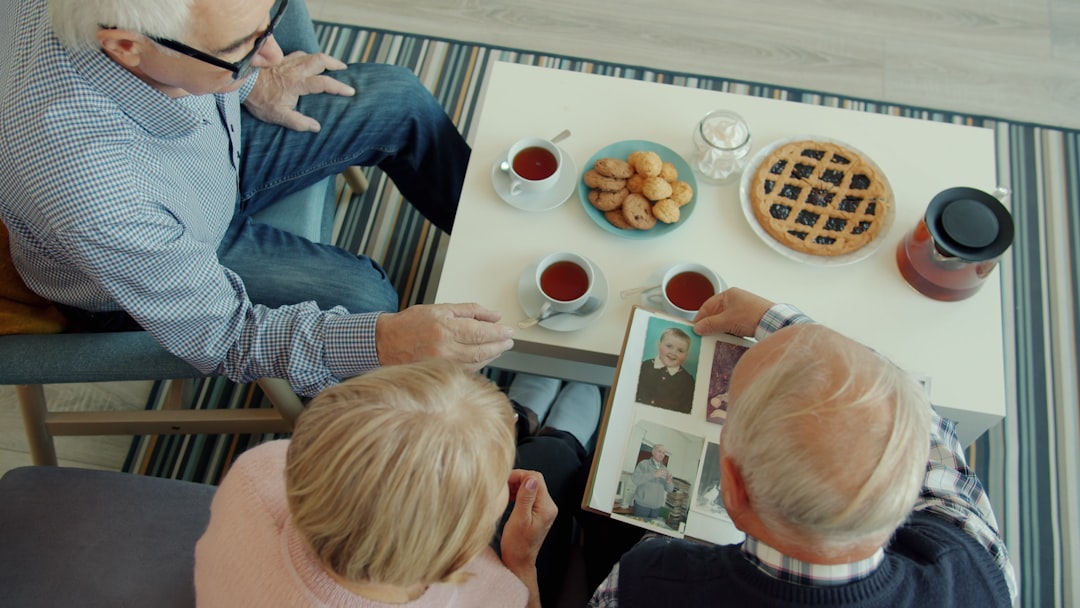 future multi-generational travel experiences — multi-generation family selecting restaurants and activities from a travel app on tablet