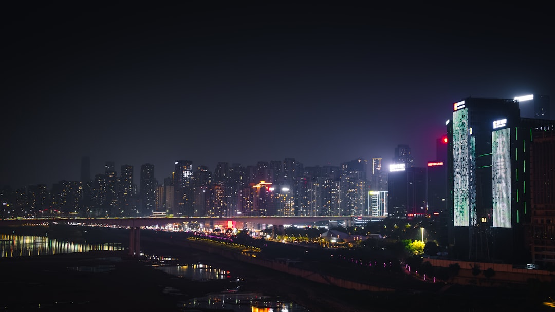 boutique hotels over global — traveler booking a room on mobile phone with city in background