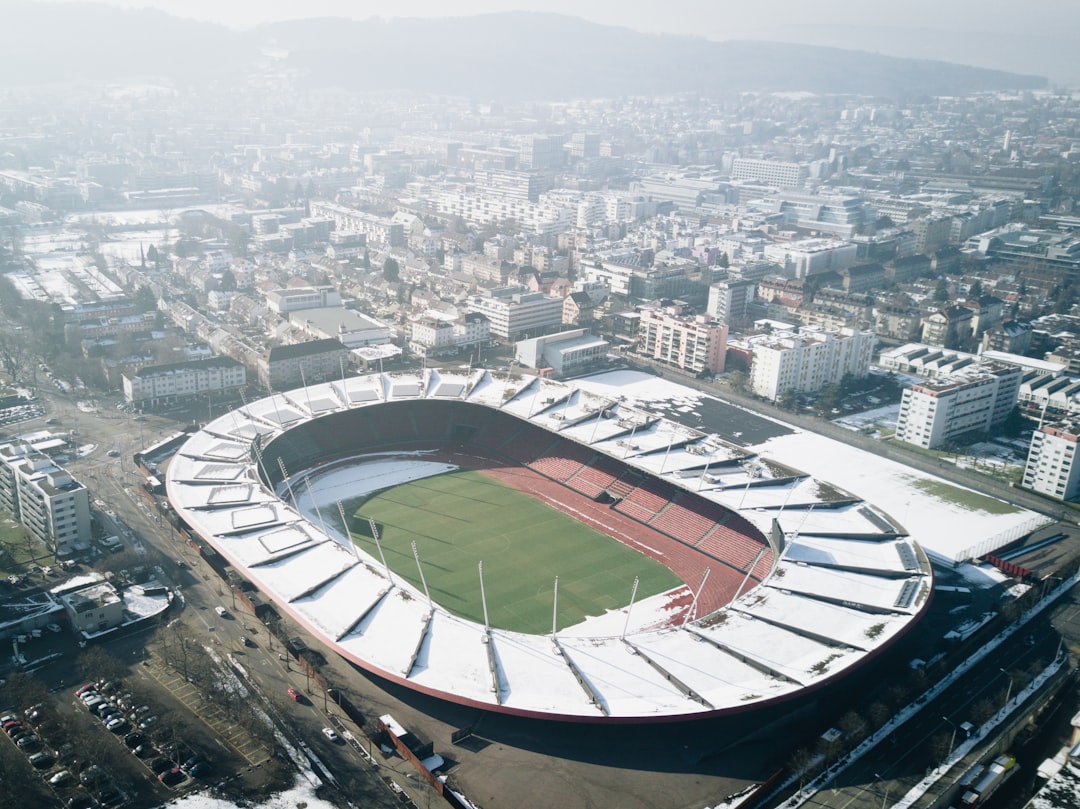rise sports tourism major — aerial view of packed stadium with colorful crowds and field