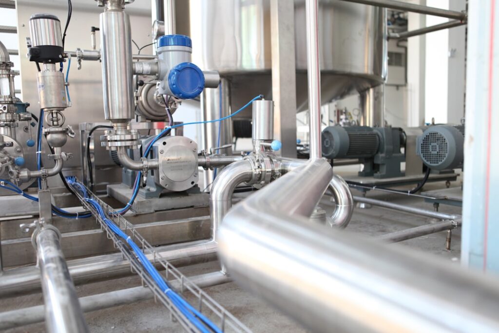 waste-to-energy projects urban infrastructure — modern waste facility industrial pipes
