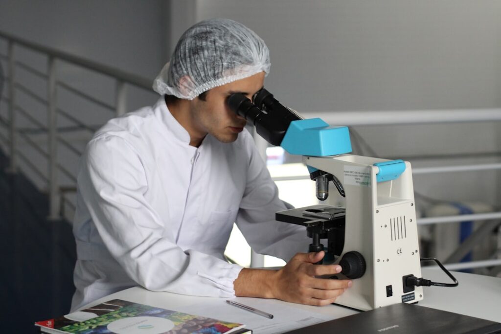 future gene therapy emerging — lab technician dna microscope analysis