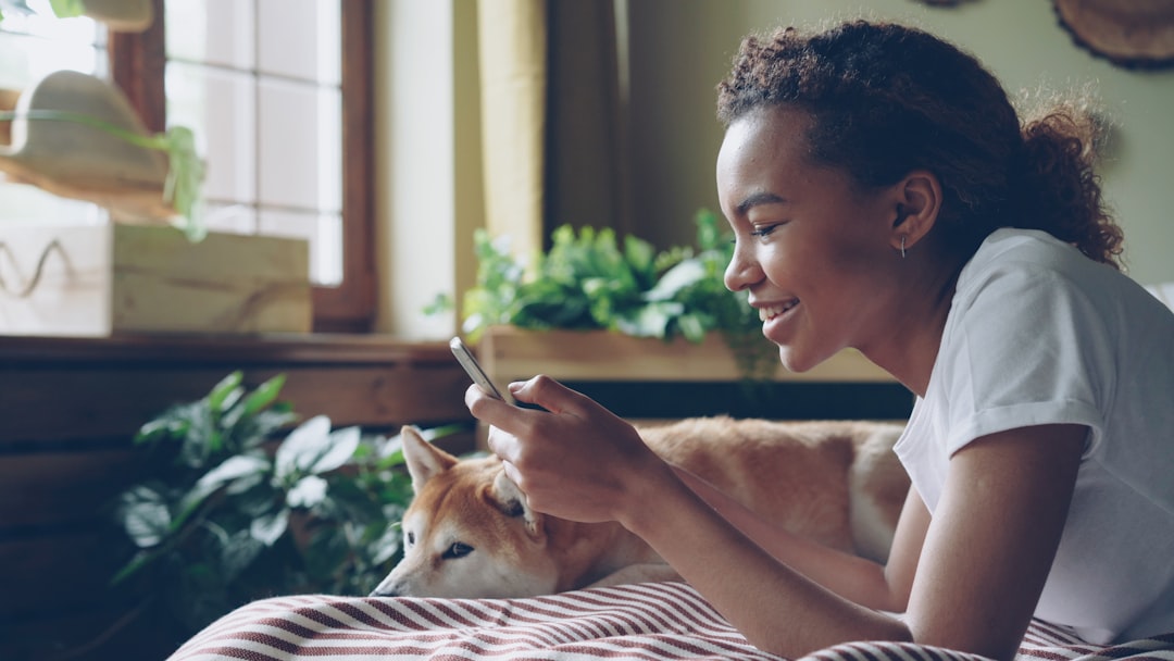 growing business pet care — owner reviewing pet wellness app on smartphone