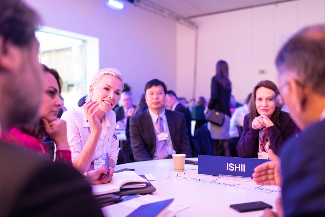 universities stronger partnerships industry — partners discussing research strategy at conference table