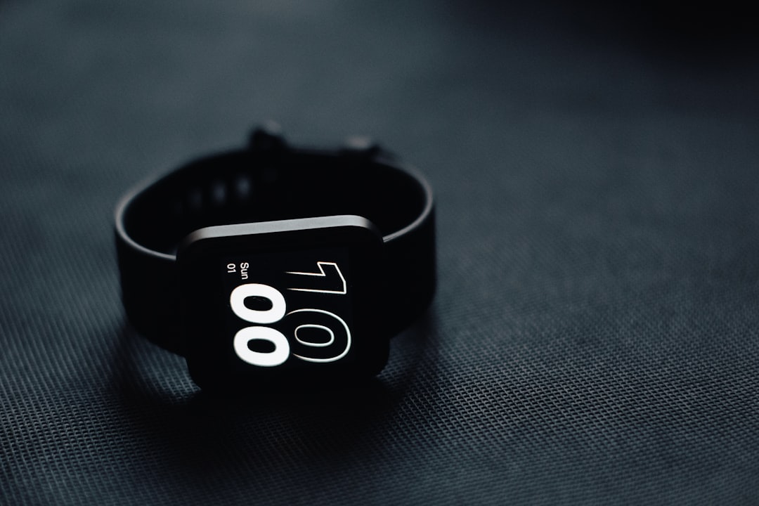 sleep technology major consumer — smartwatch on a nightstand with heart rate data displayed