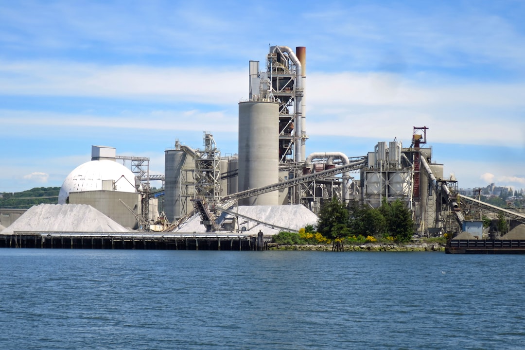 carbon capture strategic industry — industrial cement kiln with monitoring sensors and flue gas intake