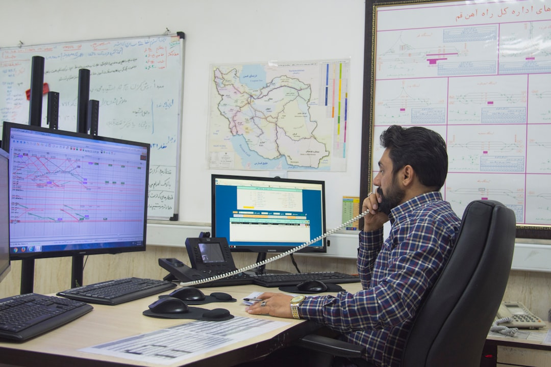 microgrids essential energy resilience — smart grid control center with technician monitoring real-time energy management dashboard