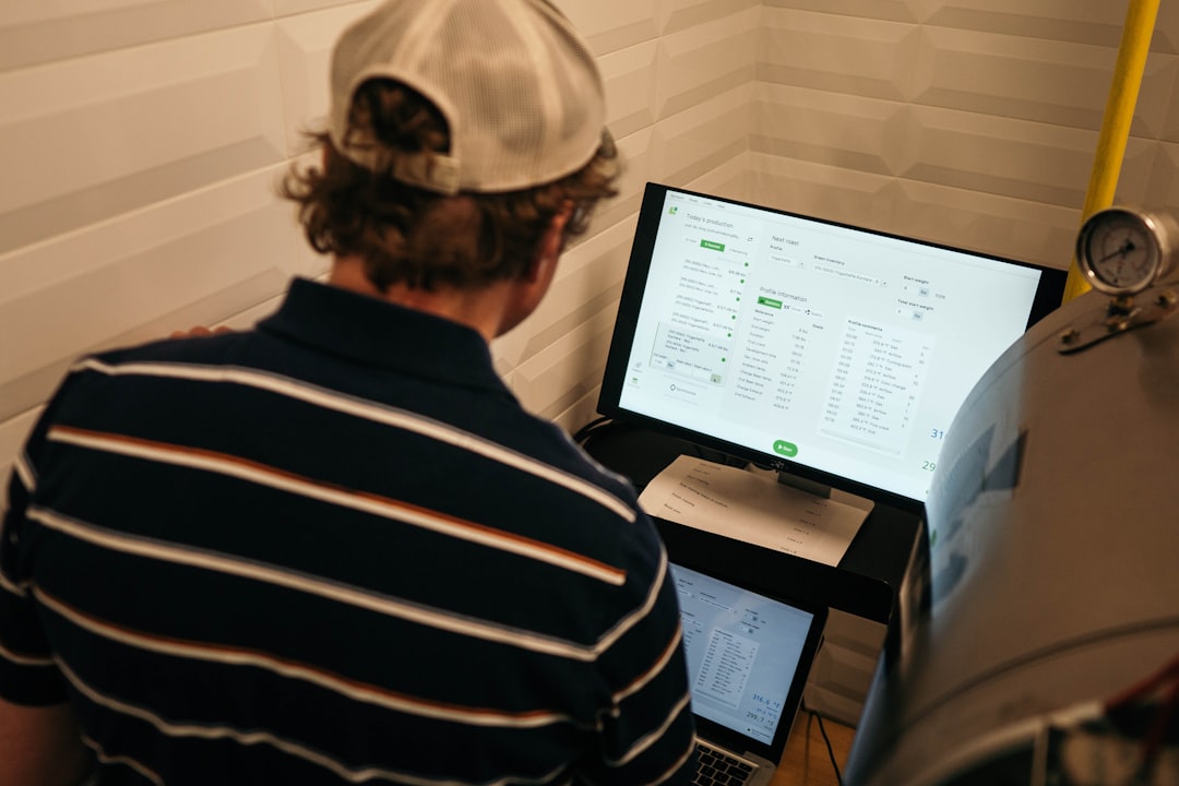 global expansion desalination future — technician monitoring desalination control room with digital displays showing real-time water production metrics