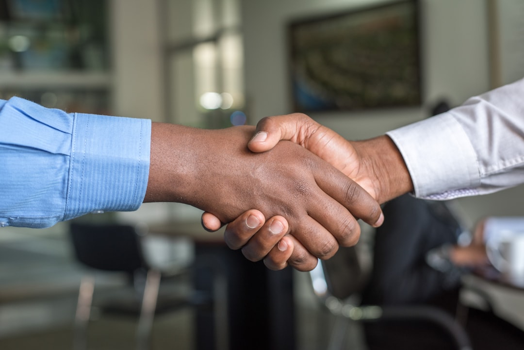 growing business carbon markets — diverse global project developers shaking hands at international climate conference