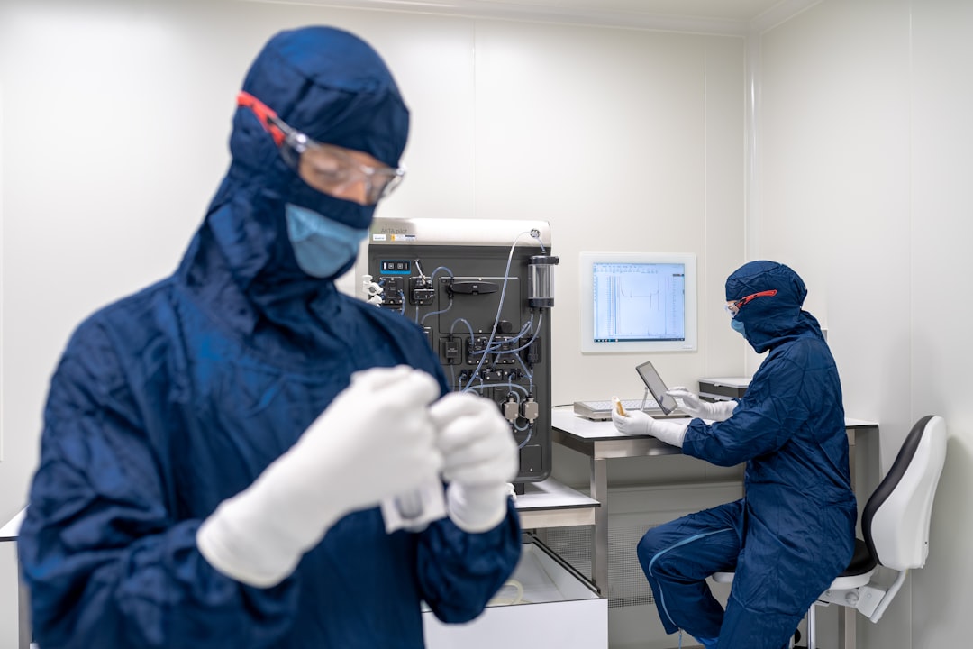 semiconductor packaging next technology — engineers examining advanced chiplet assembly on laboratory workbench