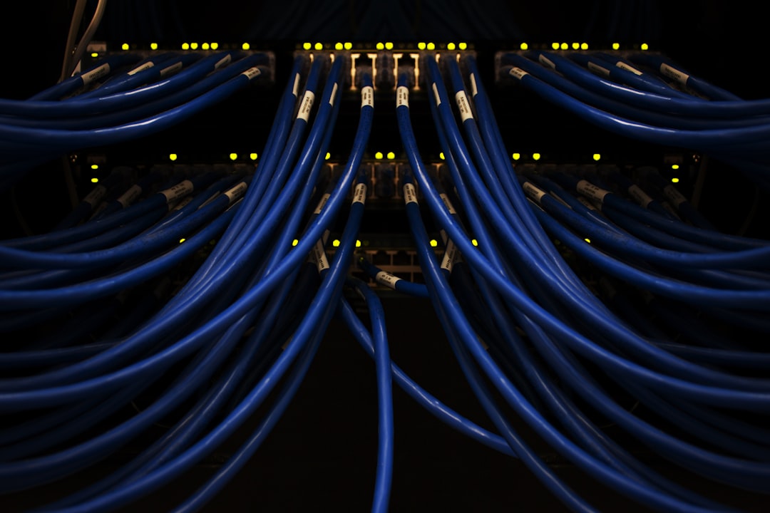photonic computing change future — server farm with fiber-optic cables and blue light trails
