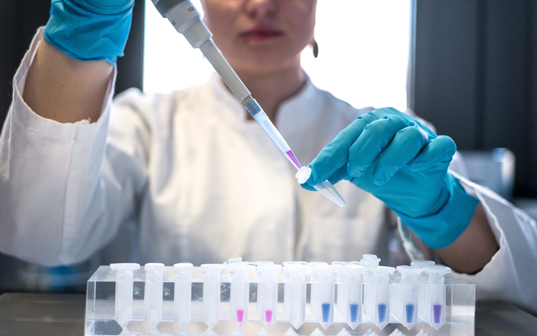 future gene therapy emerging — scientist examining vial in laboratory