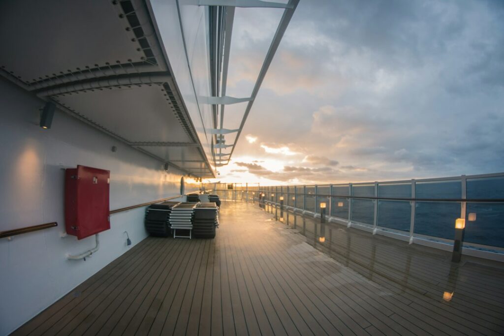 wellness cruises new travel — yoga class ocean deck sunrise