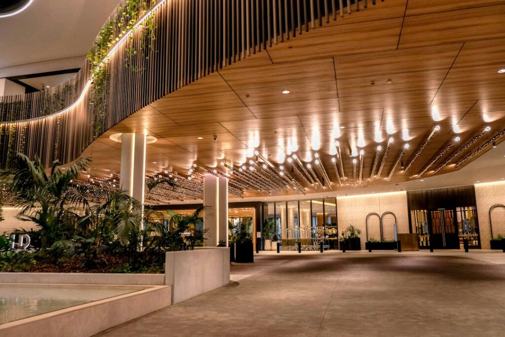 accessible tourism global hospitality — wheelchair user hotel lobby entrance