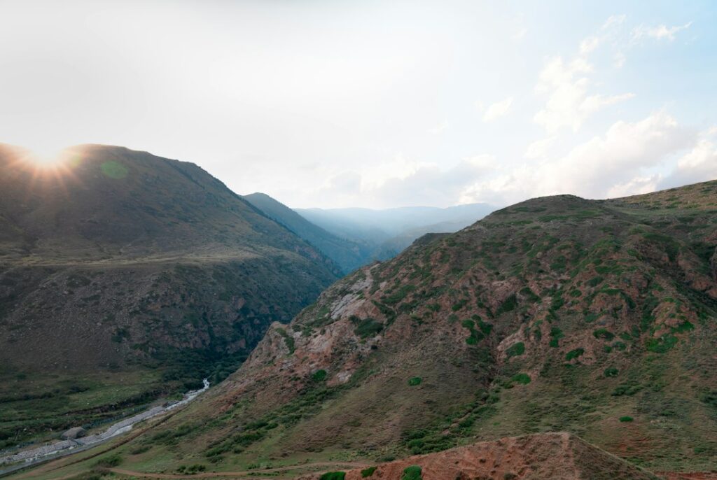 growing popularity slow adventure — traveler hiking mountain valley alone