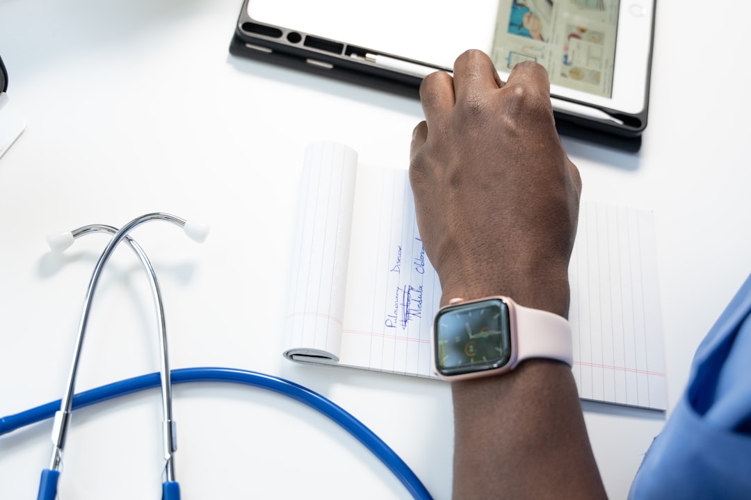 wearable medical devices preventive — healthcare dashboard integrating smartwatch metrics with patient record