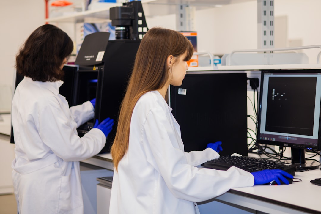 growing role precision medicine — healthcare professional analyzing data on multiple screens